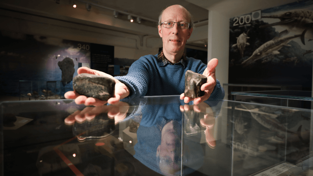 Dr Mike Simms holding fossils