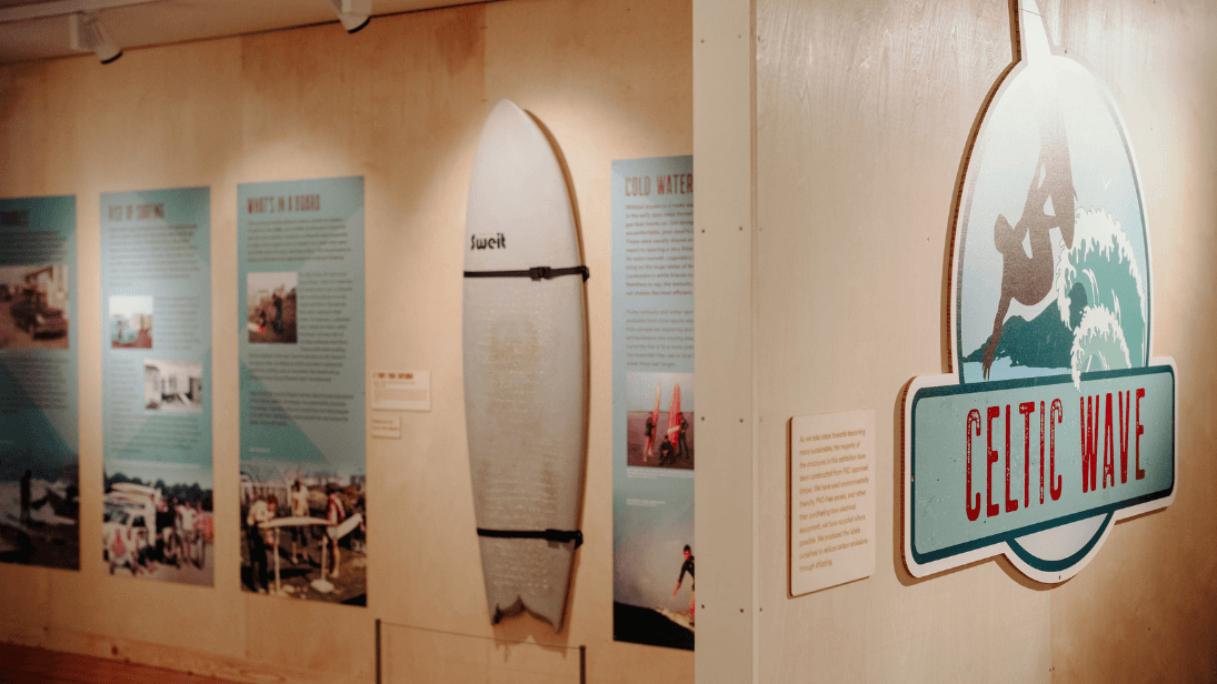 Artefacts including a surfboard on display in the Celtic Wave exhibition at Ulster Transport Museum