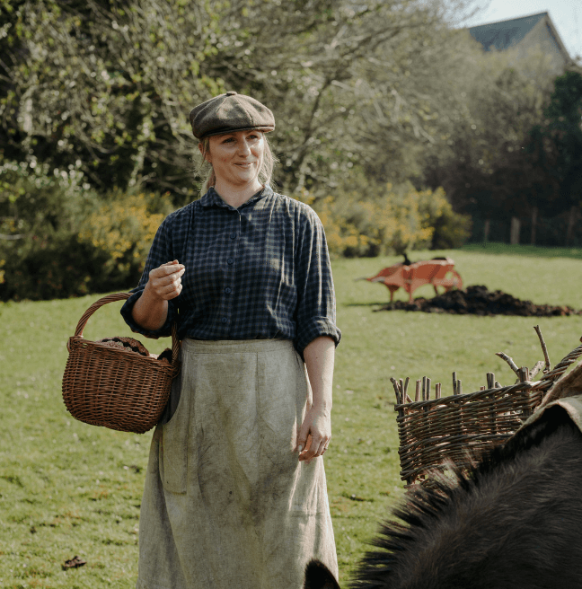 Woman on a farm with a basket, old fashioned